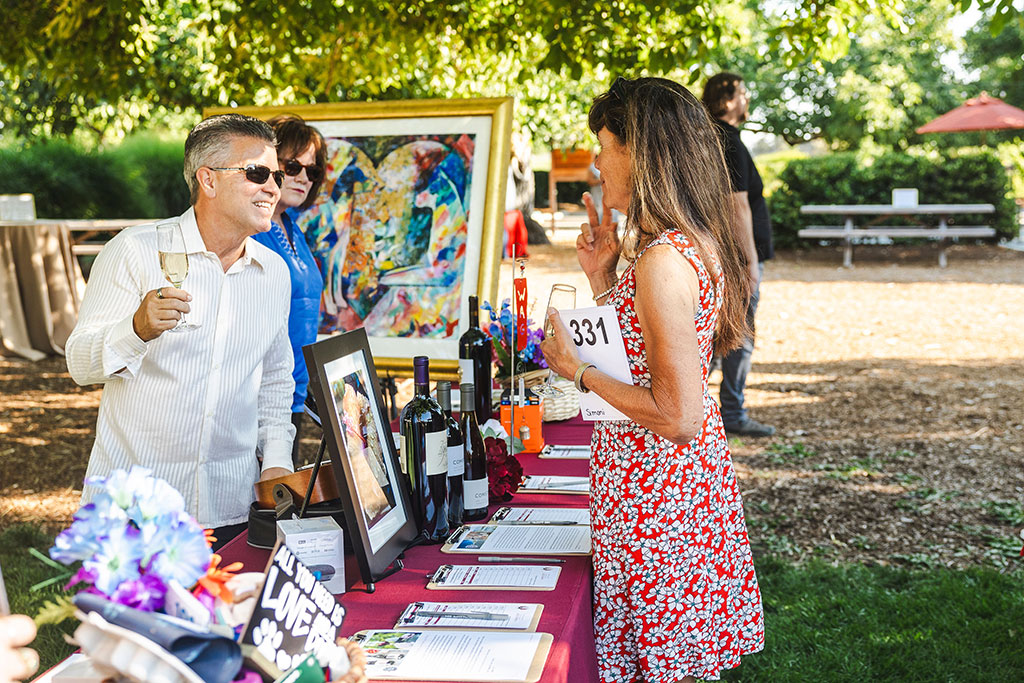 Patrons perusing auction items